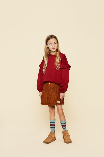 Roodbruine meisjes-sweater met sierlijke ruches langs de mouwen van A Monday In Copenhagen. | Verkrijgbaar voor meisjes van 4 tot 12 bij Little Fashion Addict.